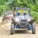 Two UTVs driving on a dirt road